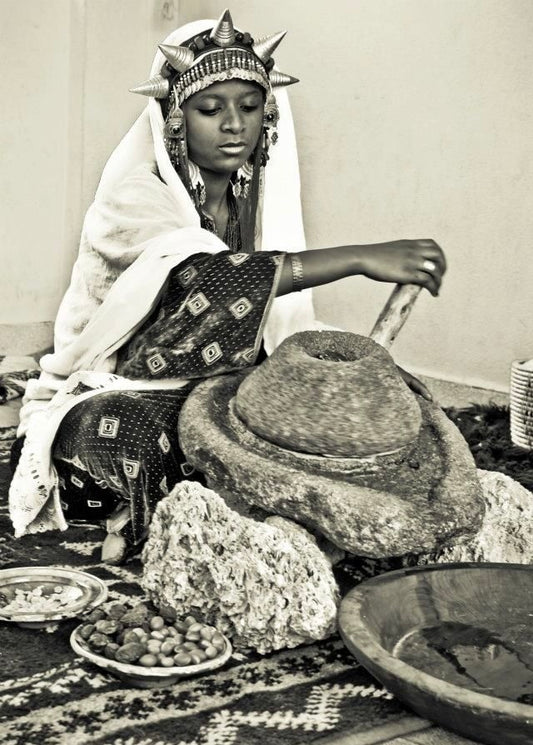 Moroccan Woman Processing Argan in a Shiv Linga Machine